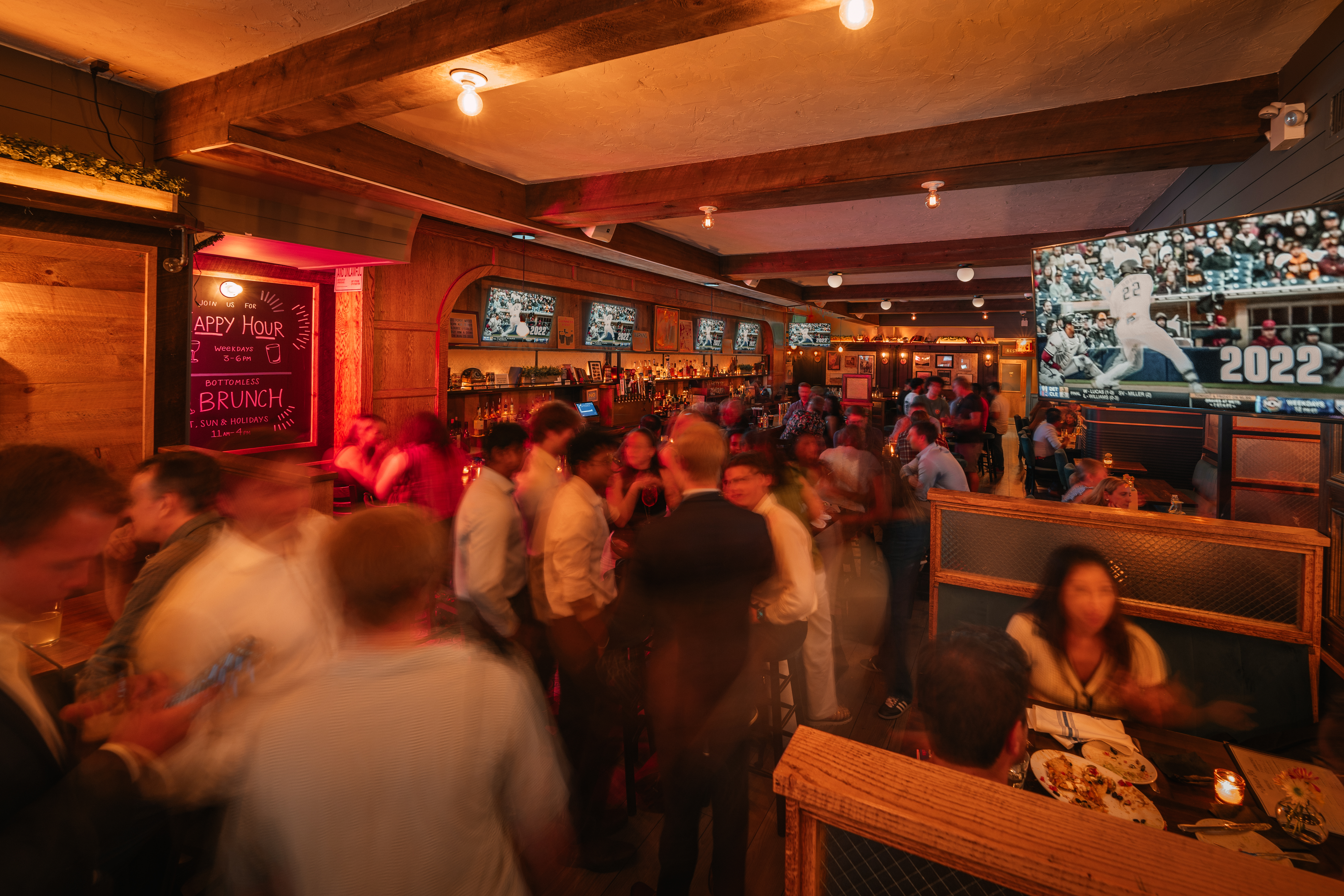 a group of people sitting at a bar