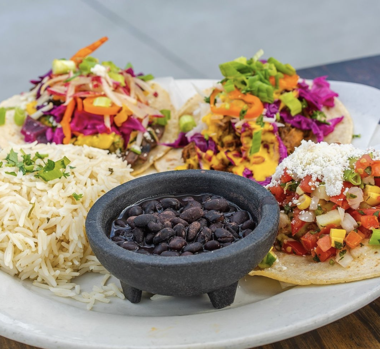 a plate of food with rice and vegetables
