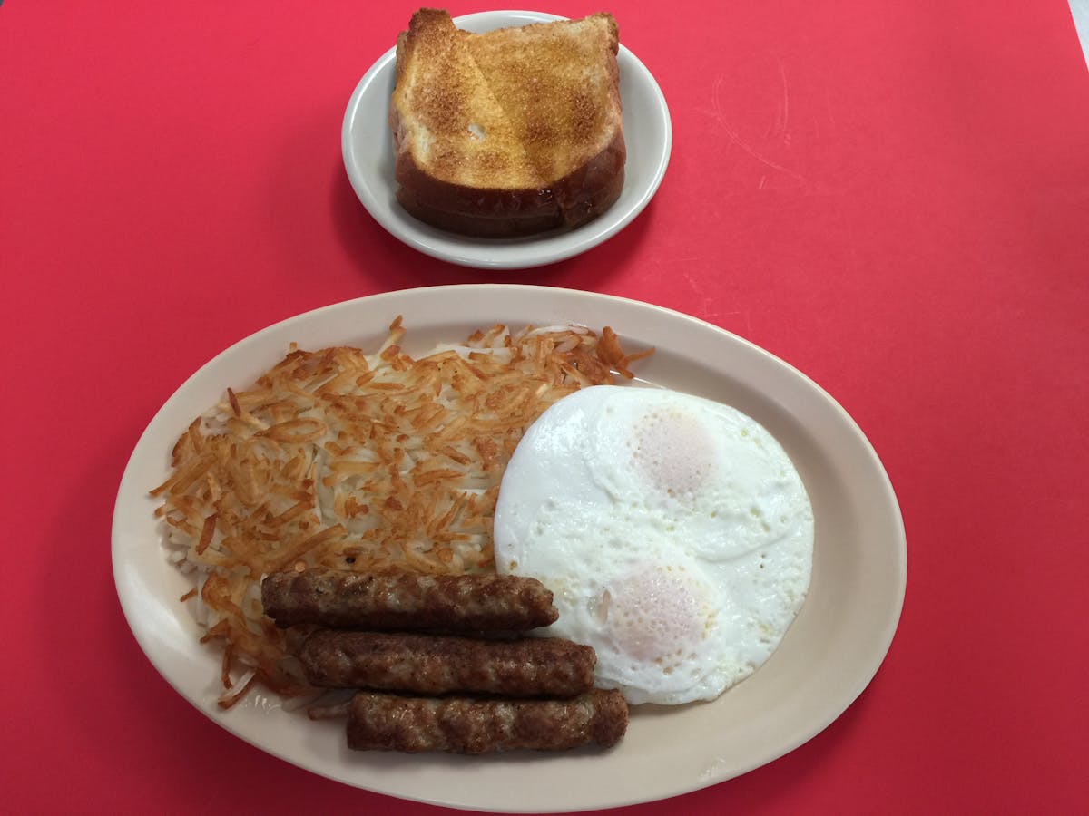 two eggs, hash browns, sausage and toast