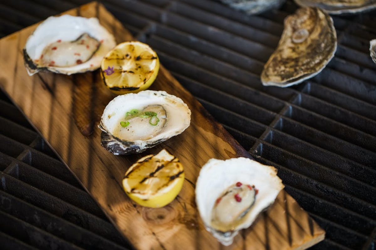 a bunch of food sitting on a wooden surface