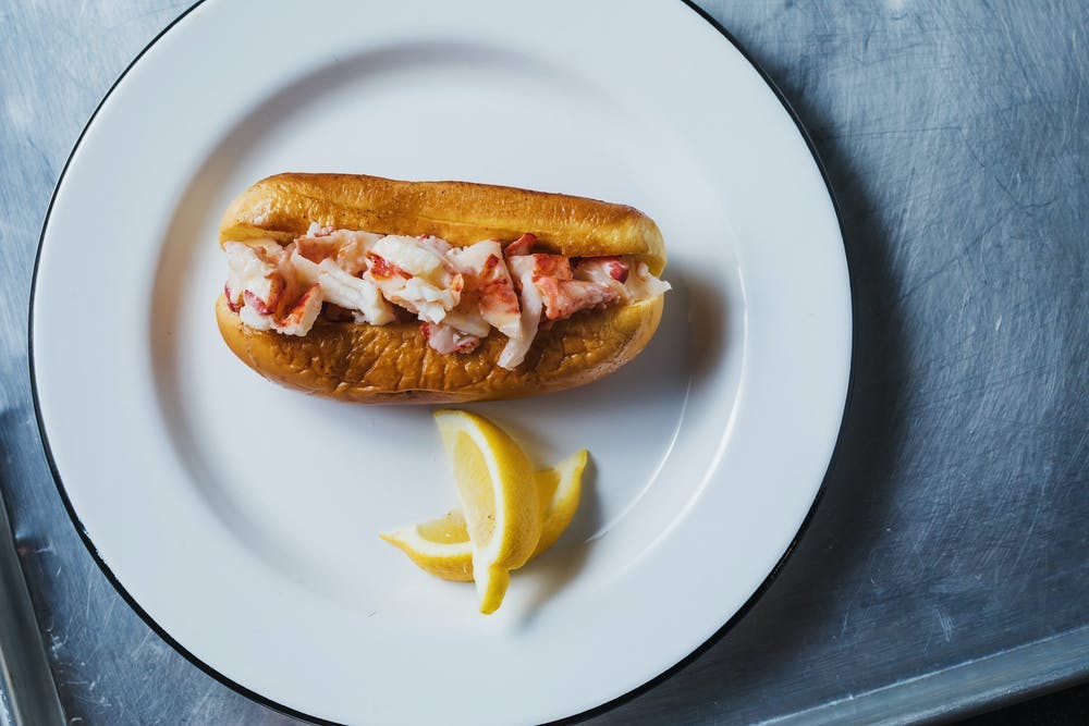 a plate with a hot dog