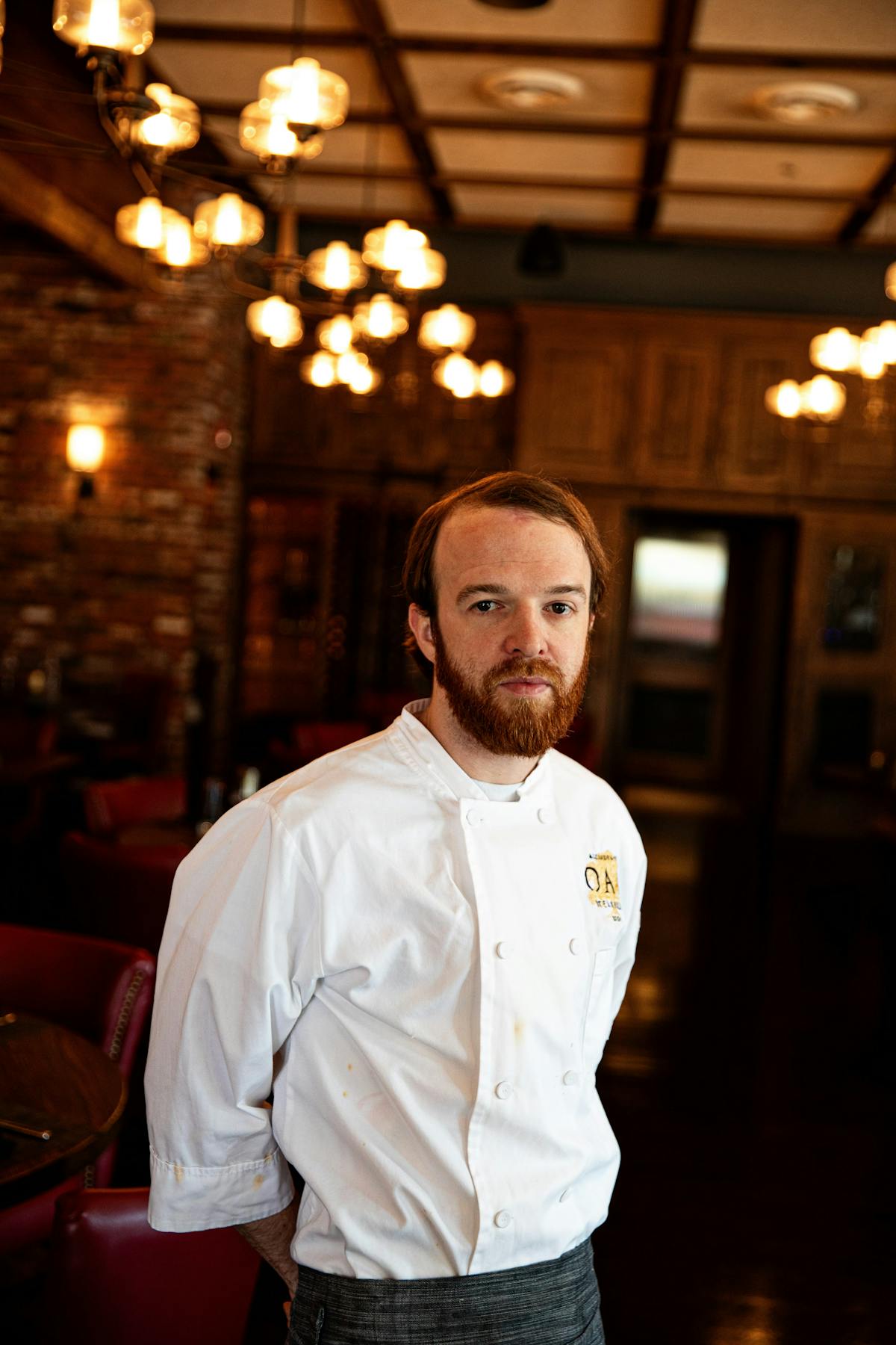 a man standing in front of a bar