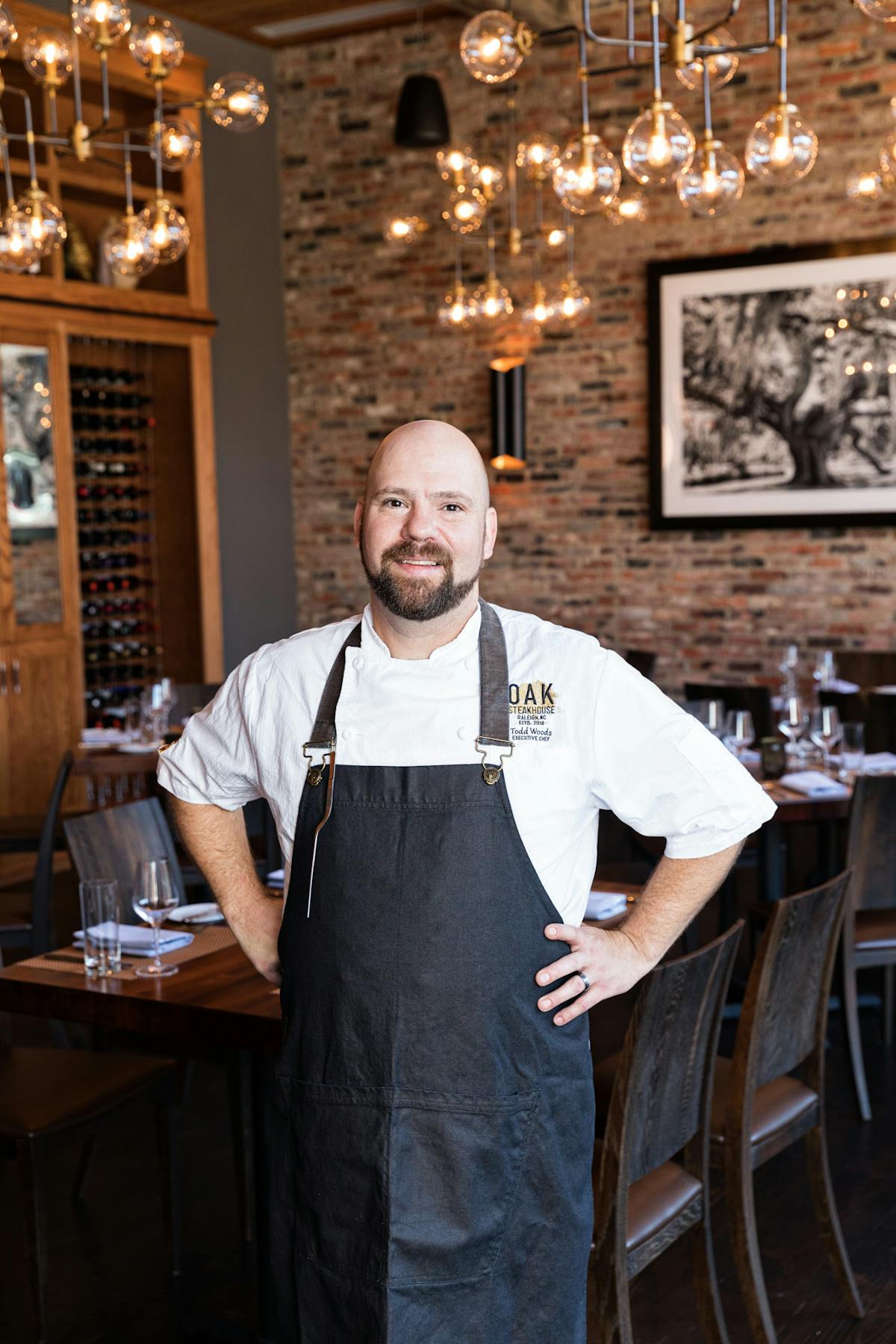 a man standing in front of a table