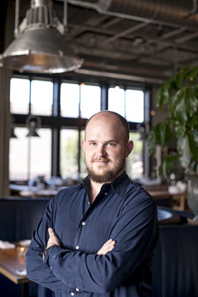 a man sitting at a table in a restaurant