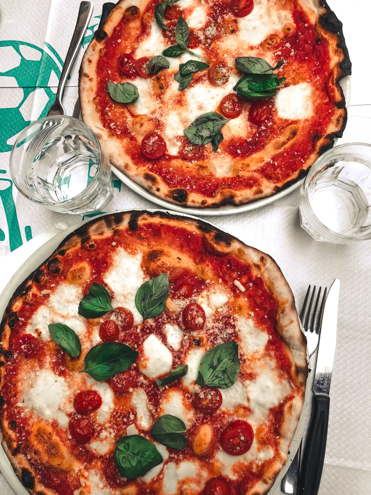 a pizza sitting on top of a plate of food