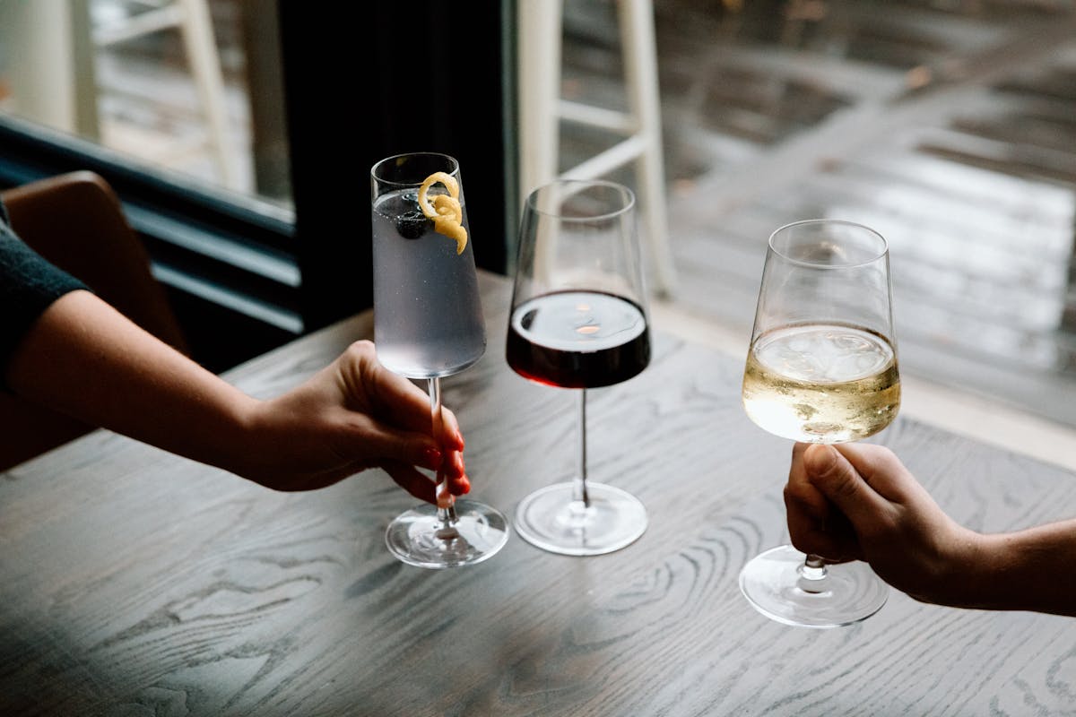 a person holding a wine glass