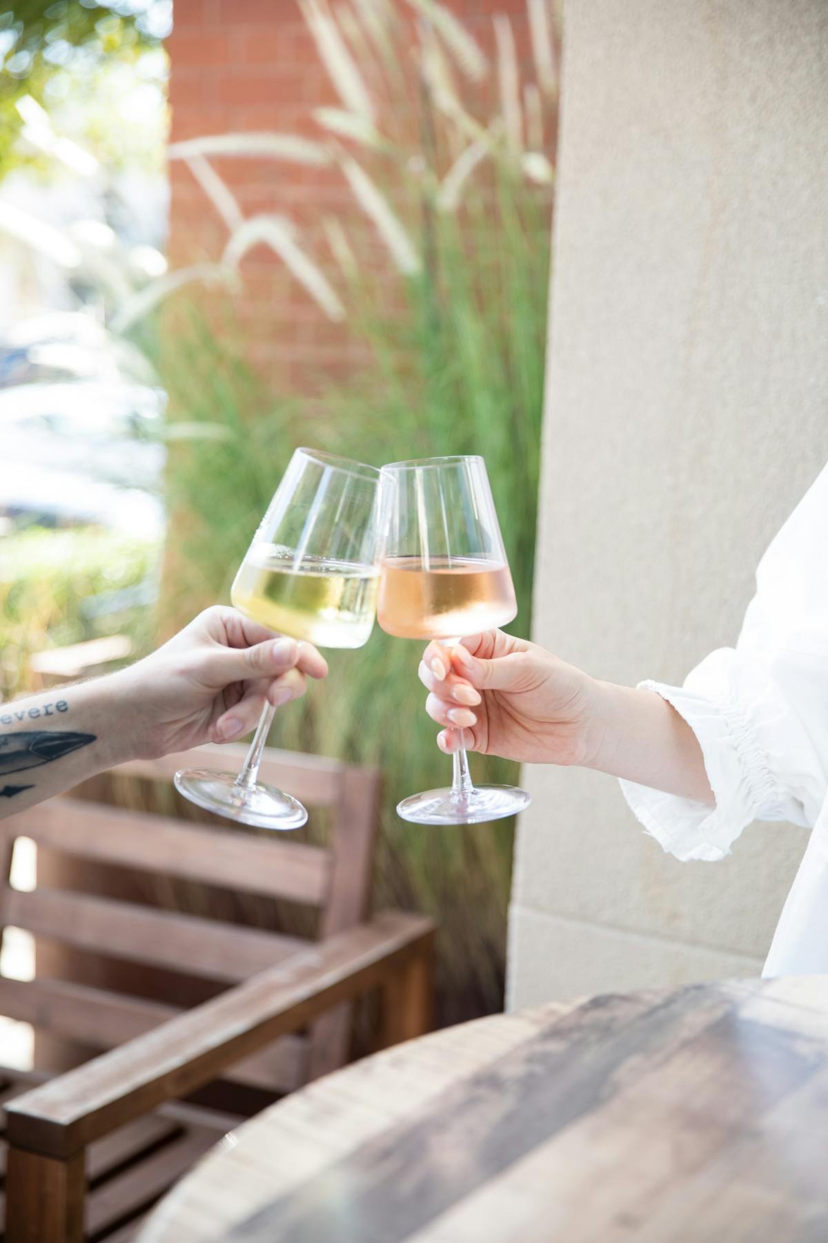 a person holding a wine glass