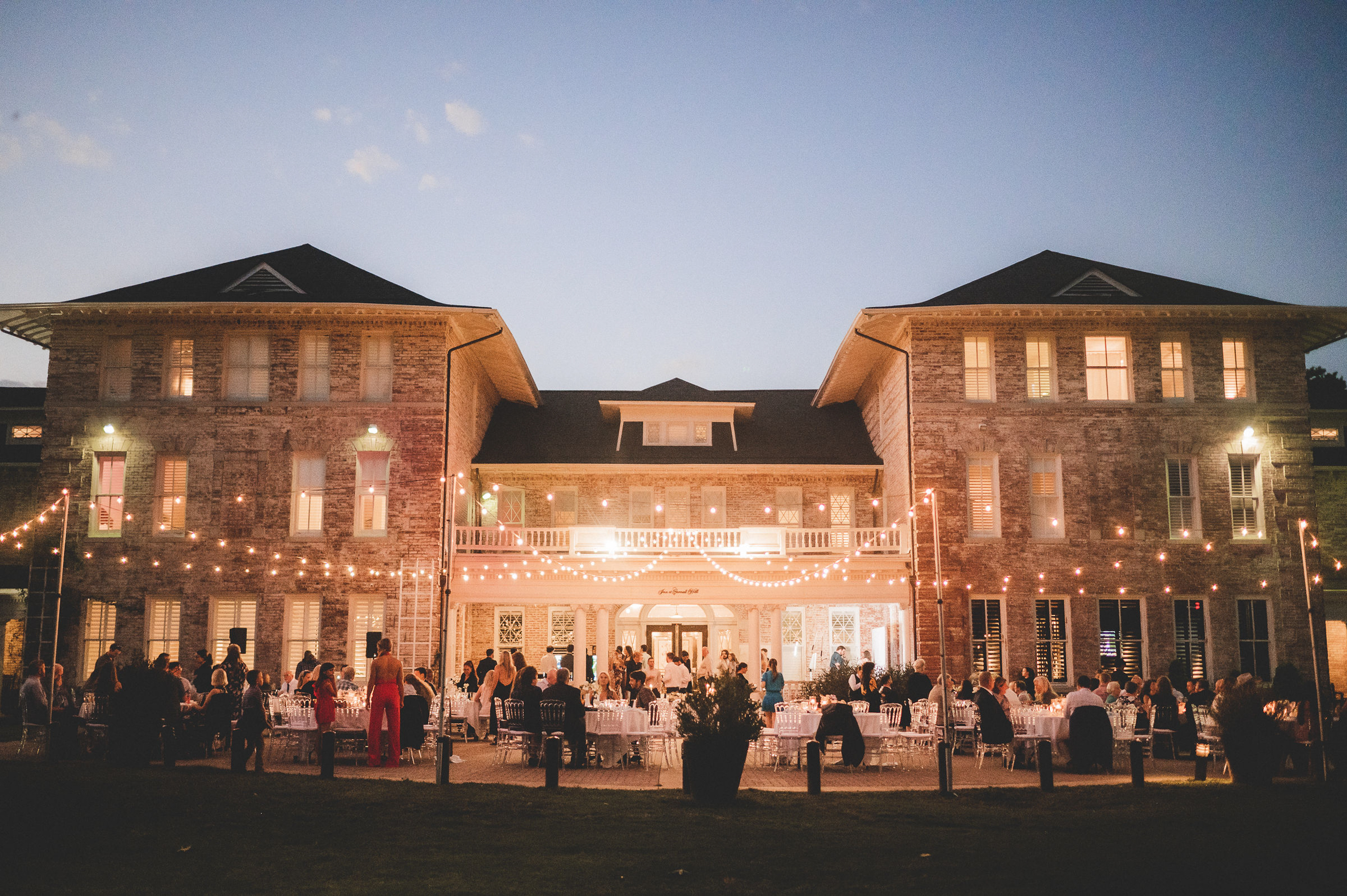 a group of people standing in front of a building