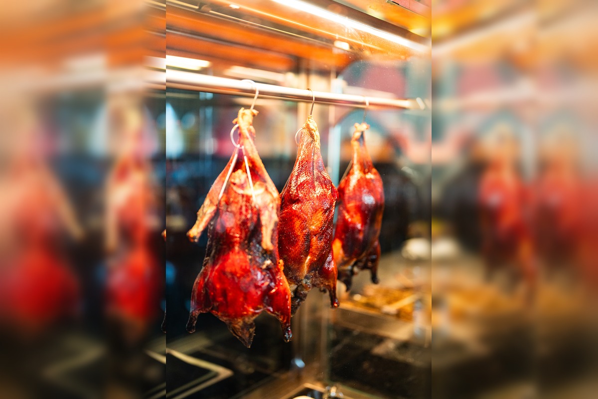 Whole smoked Peking duck carved tableside at Ro Hyde Park Tampa