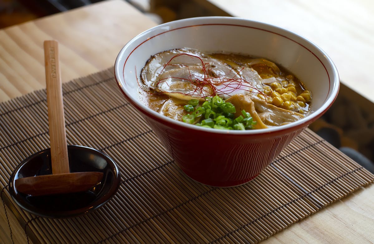 a bowl of food sitting on a table