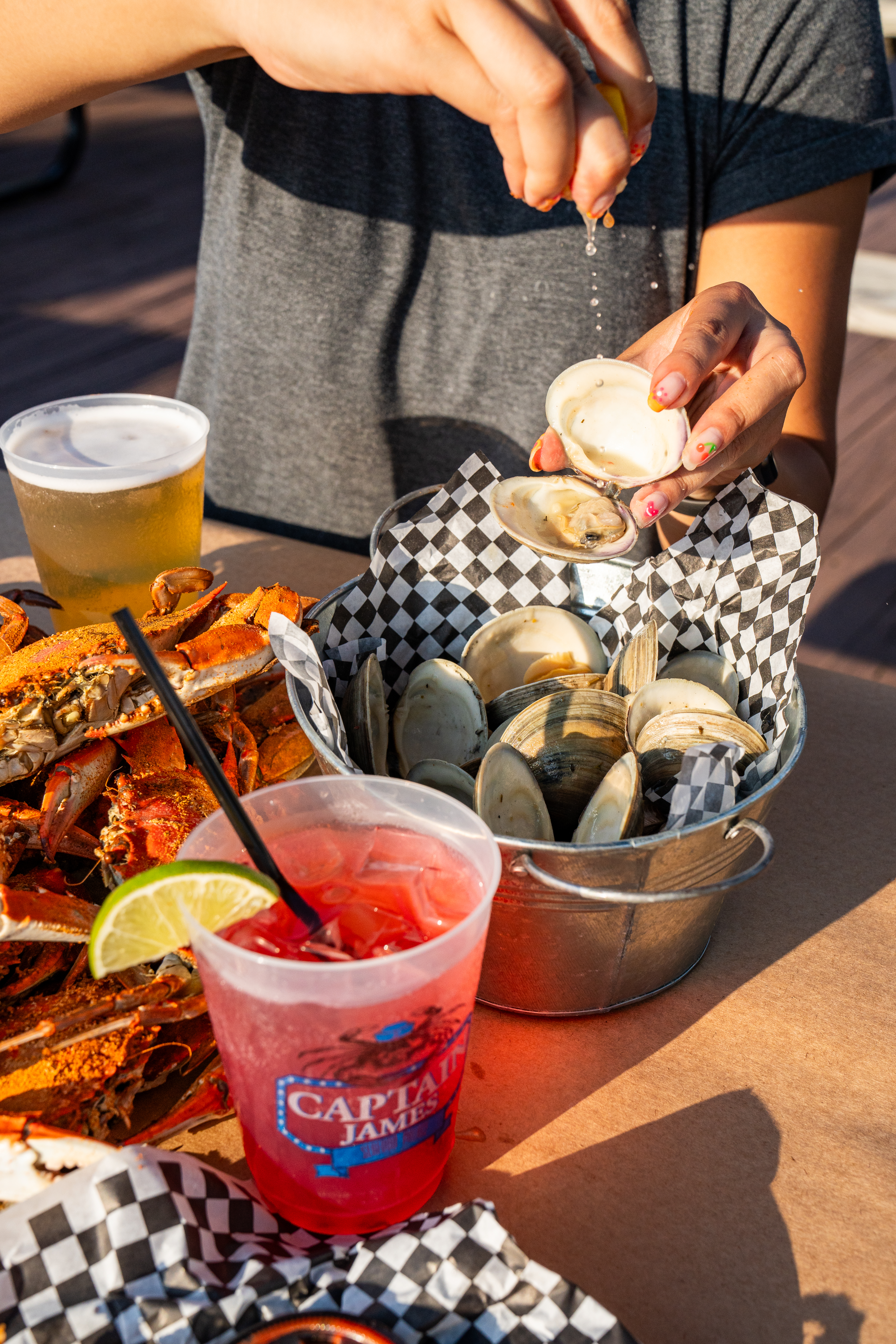 a woman sitting at a table eating food