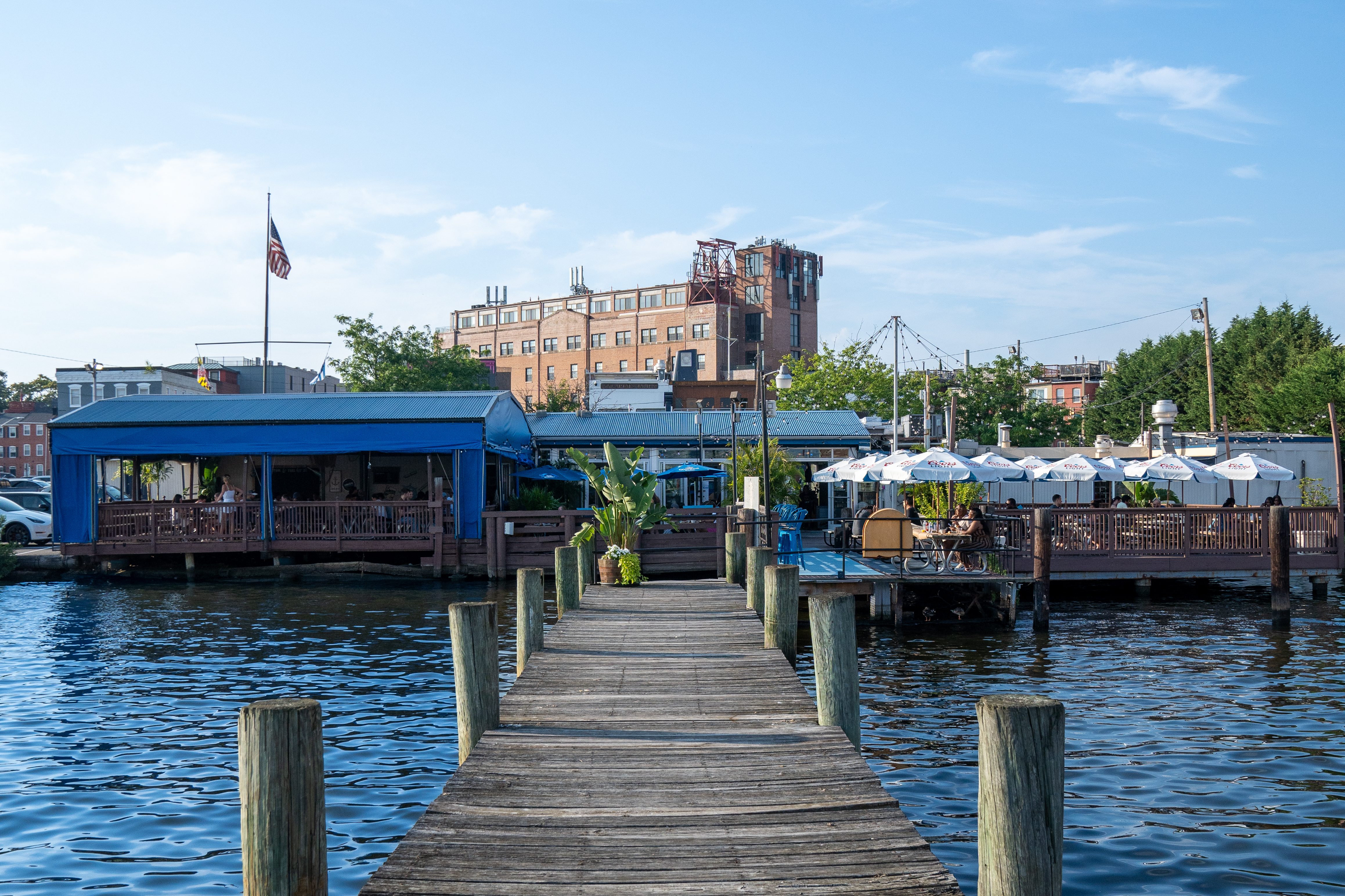 a boat that is sitting on a dock next to a body of water