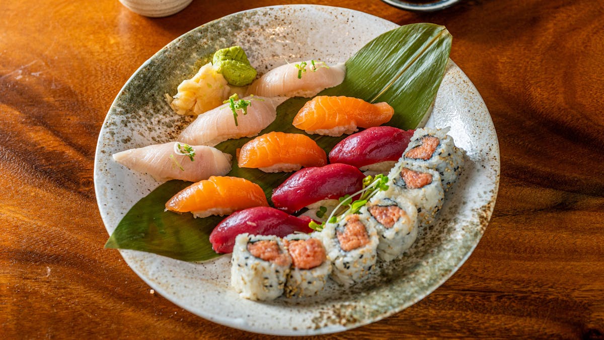 a plate of food sitting on top of a wooden table