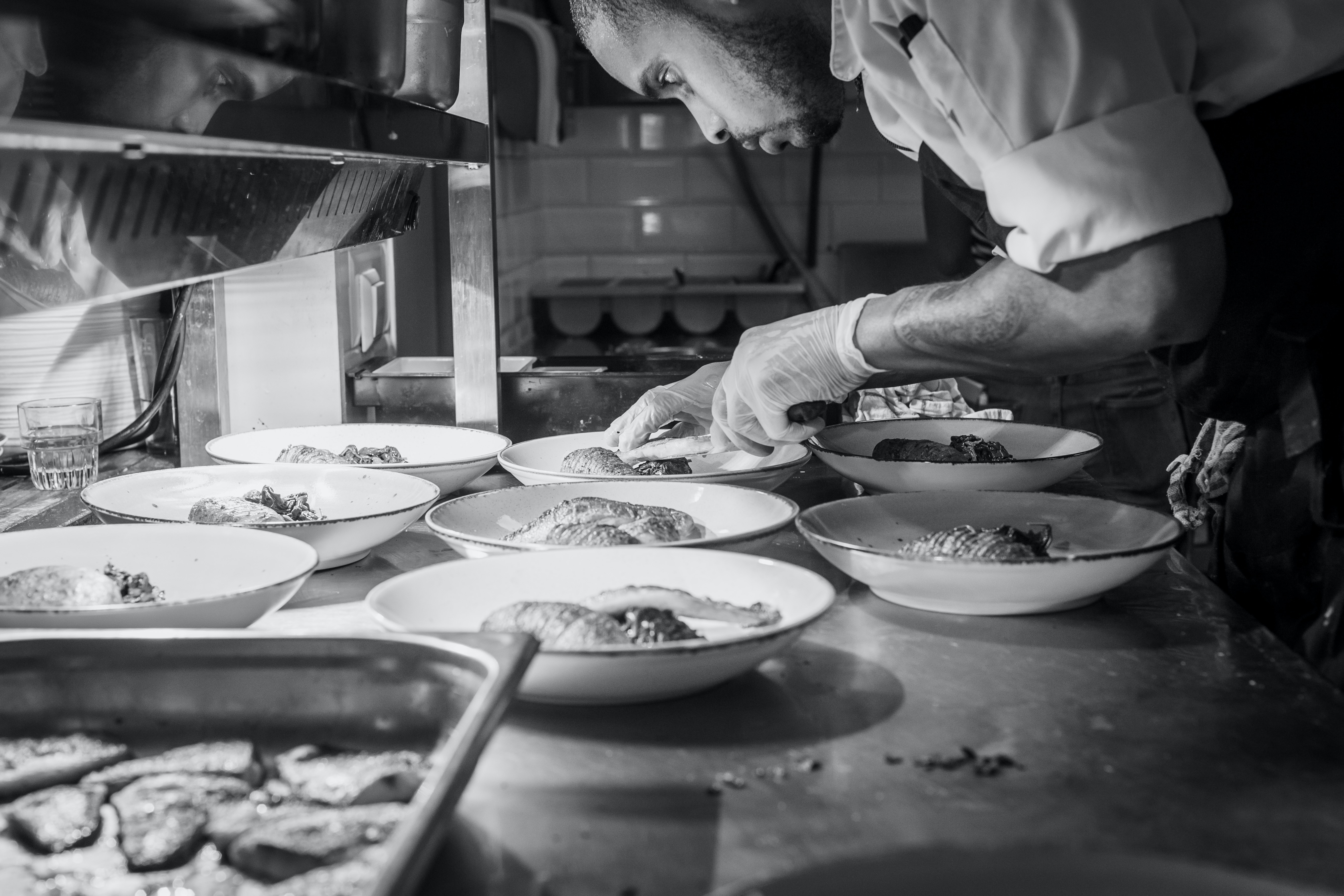 a person cooking in a kitchen preparing food
