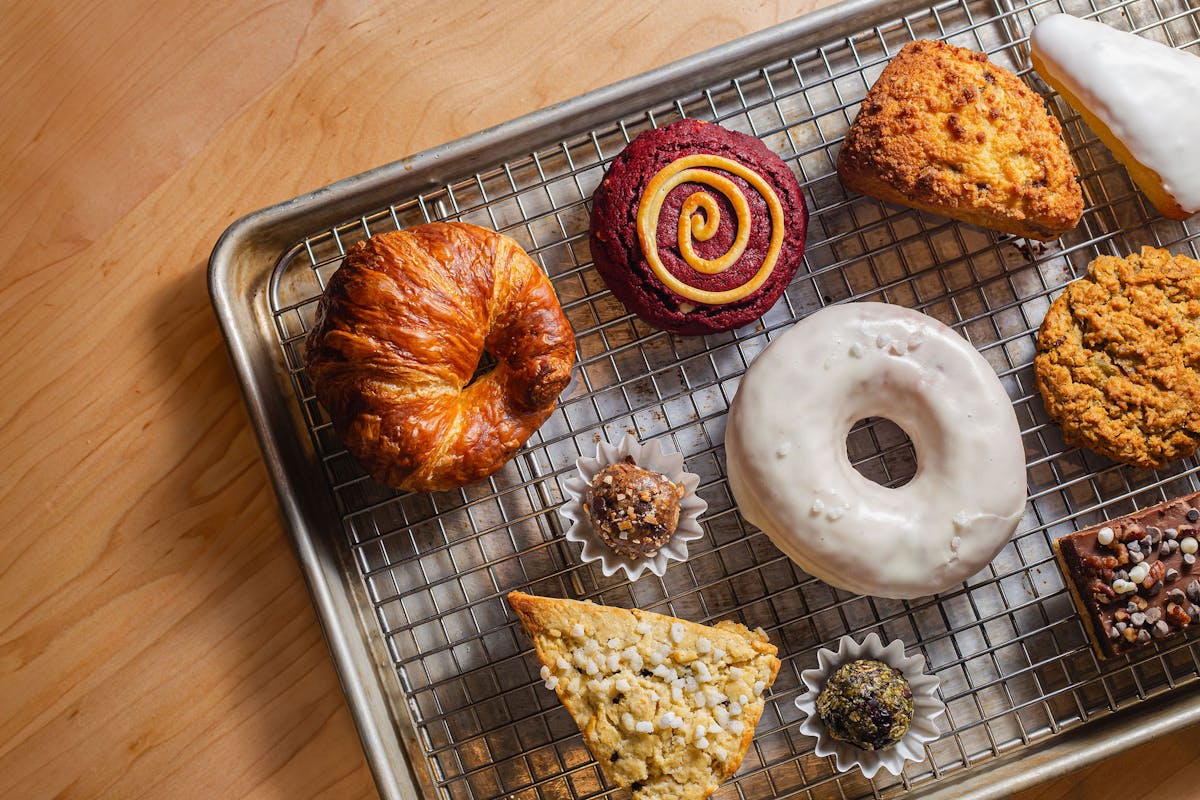 a doughnut sitting on top of a wooden table