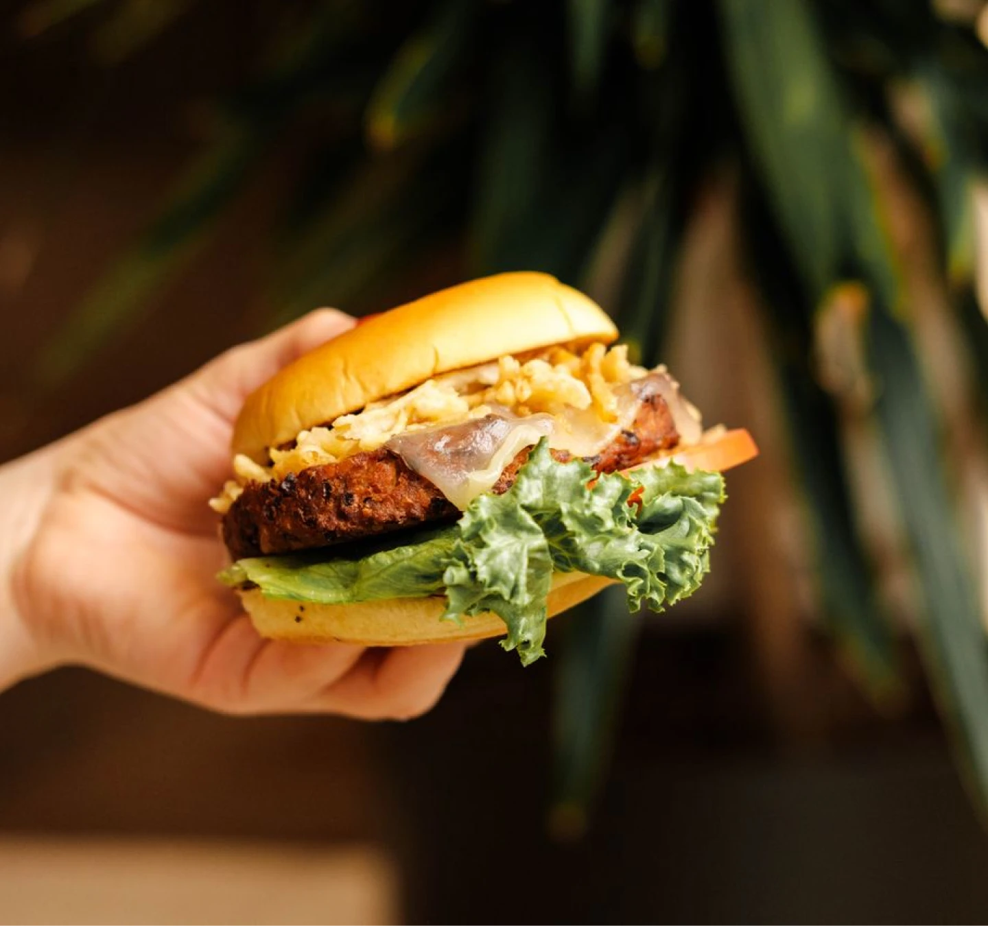 Person holding a hamburger