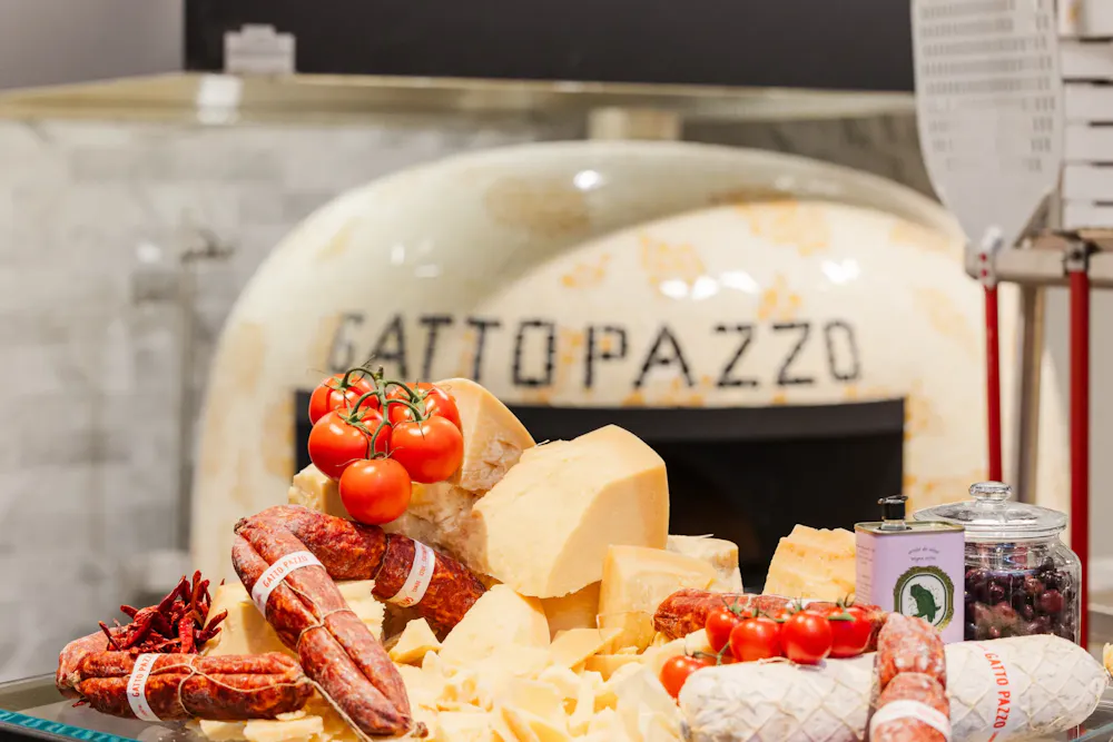 a group of cheeses and tomatoes