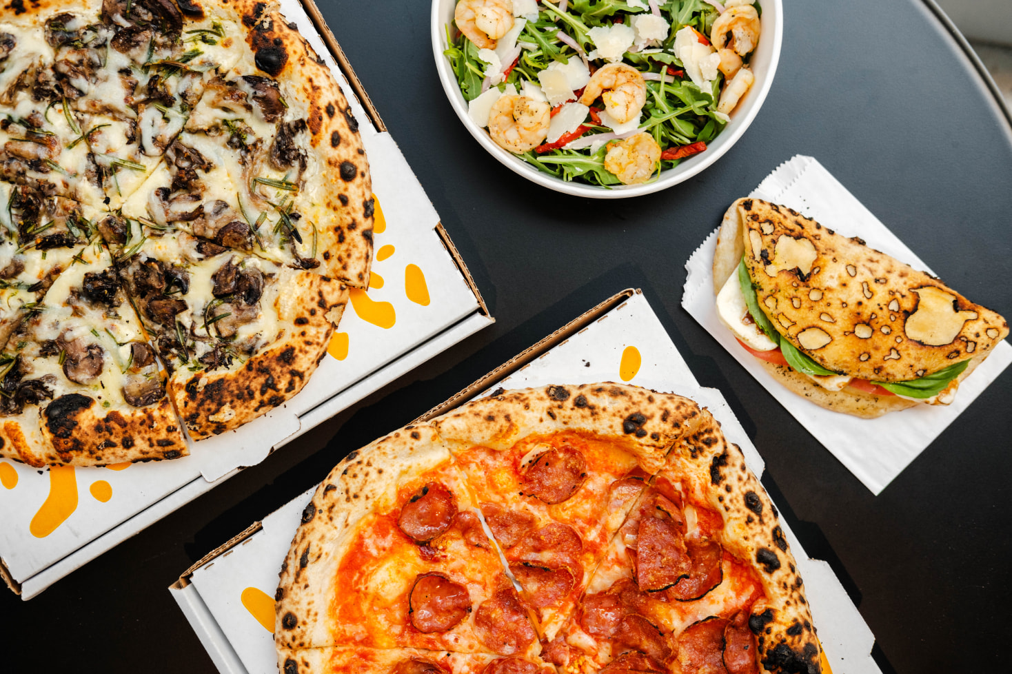 a pizza sitting on top of a plate of food