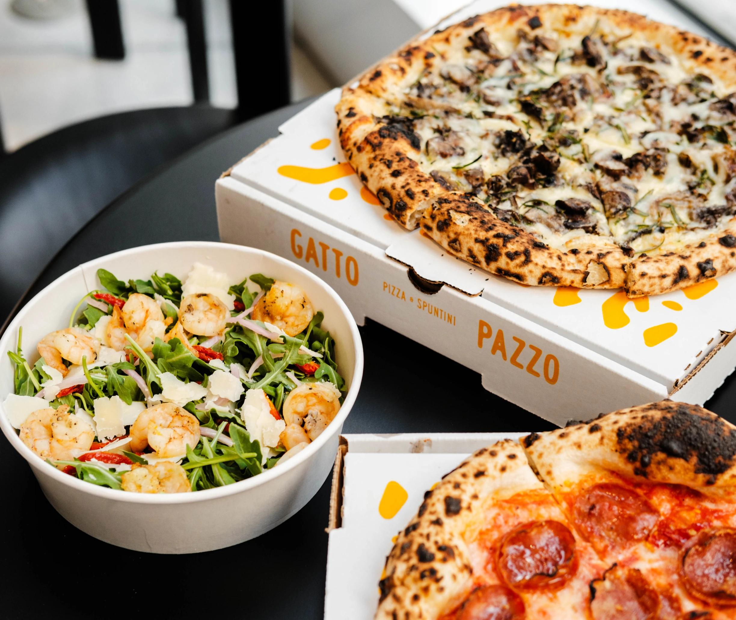 Gatto Pazzo pizzas and shrimp arugula salad