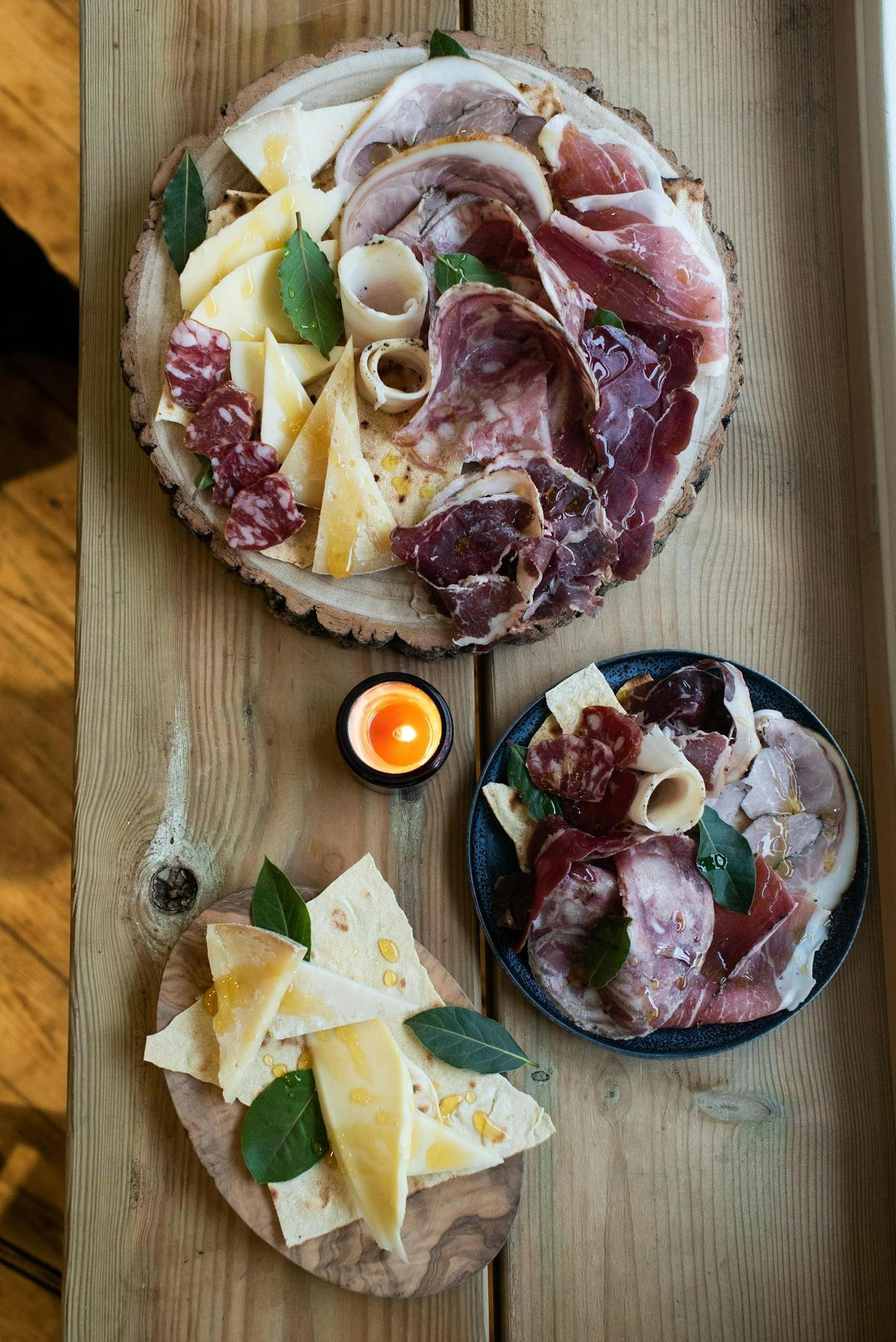 a slice of pizza sitting on top of a wooden cutting board