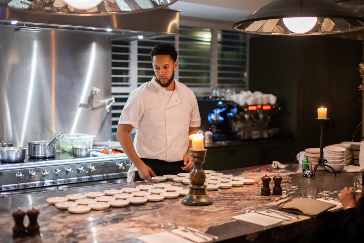 a man preparing food in a kitchen