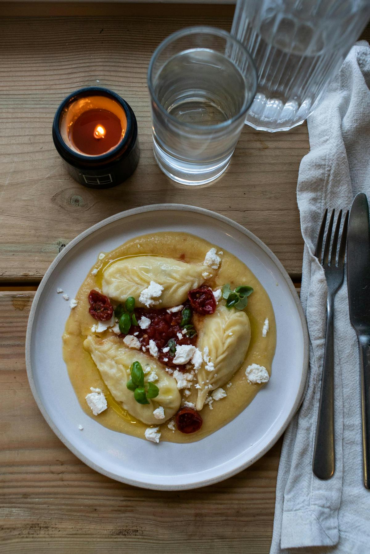 a plate of food and a cup of coffee on a table