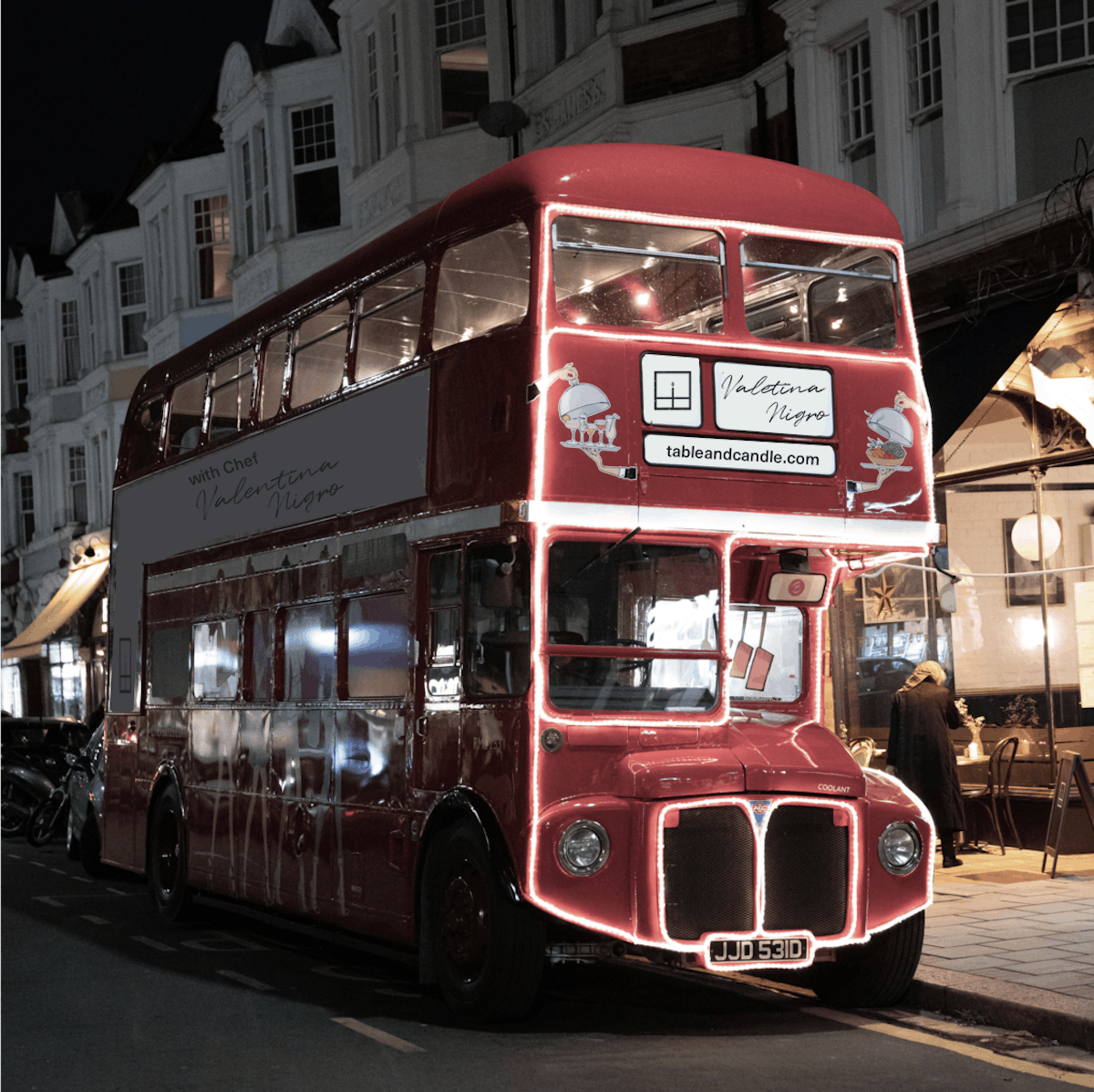 a red double decker bus on a city street