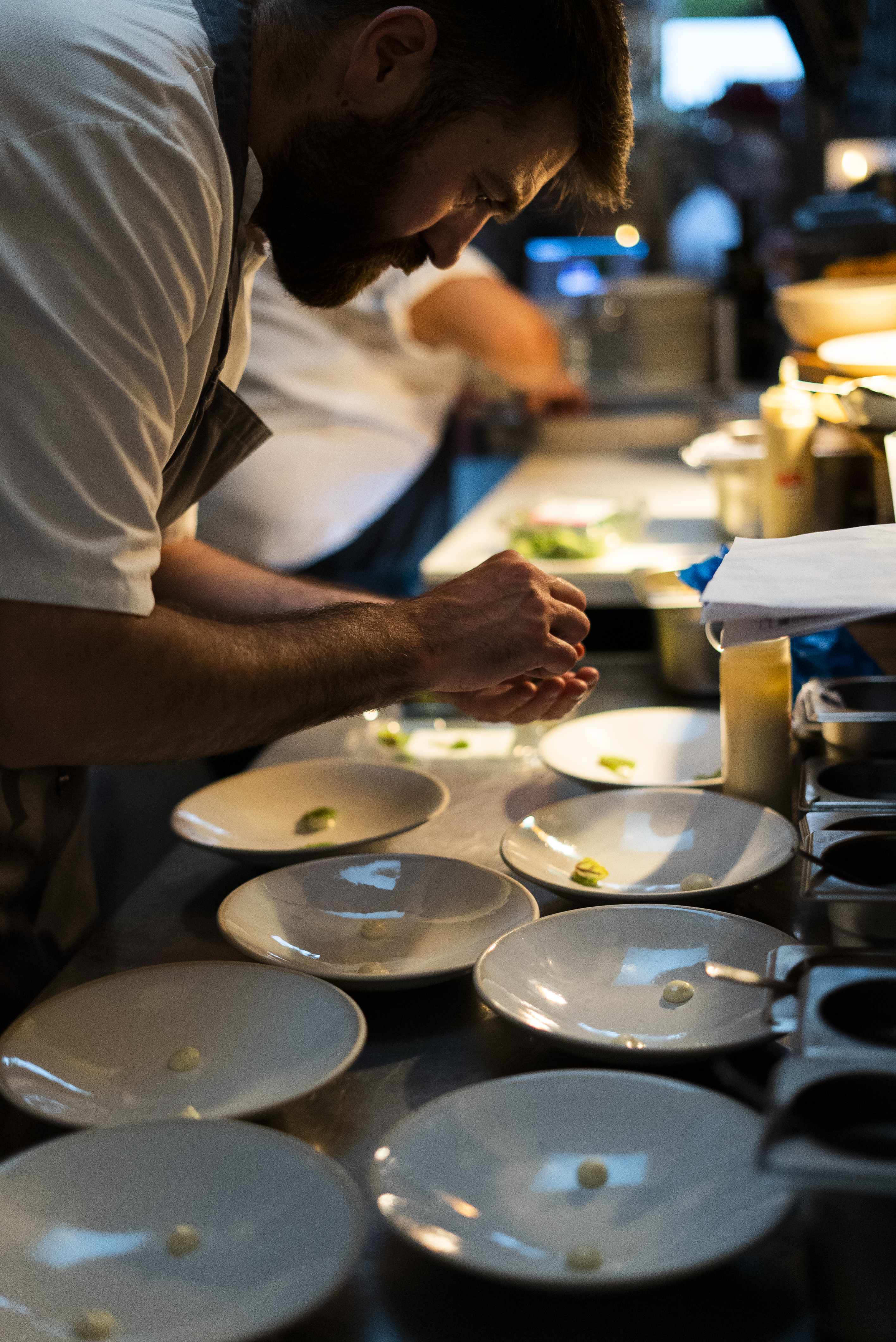 a man preparing food in a kitchen
