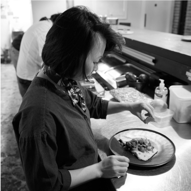 a person preparing food in a kitchen