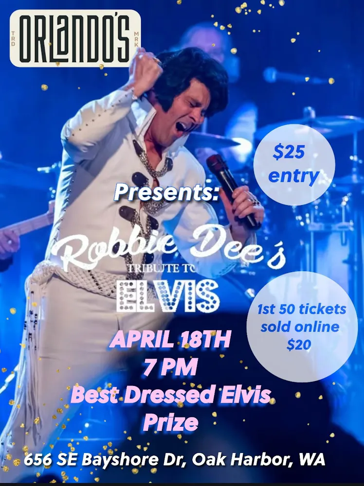 a man singing on stage with microphone