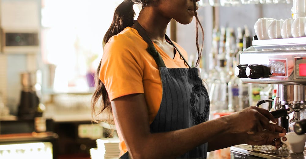 a person standing in front of a cake