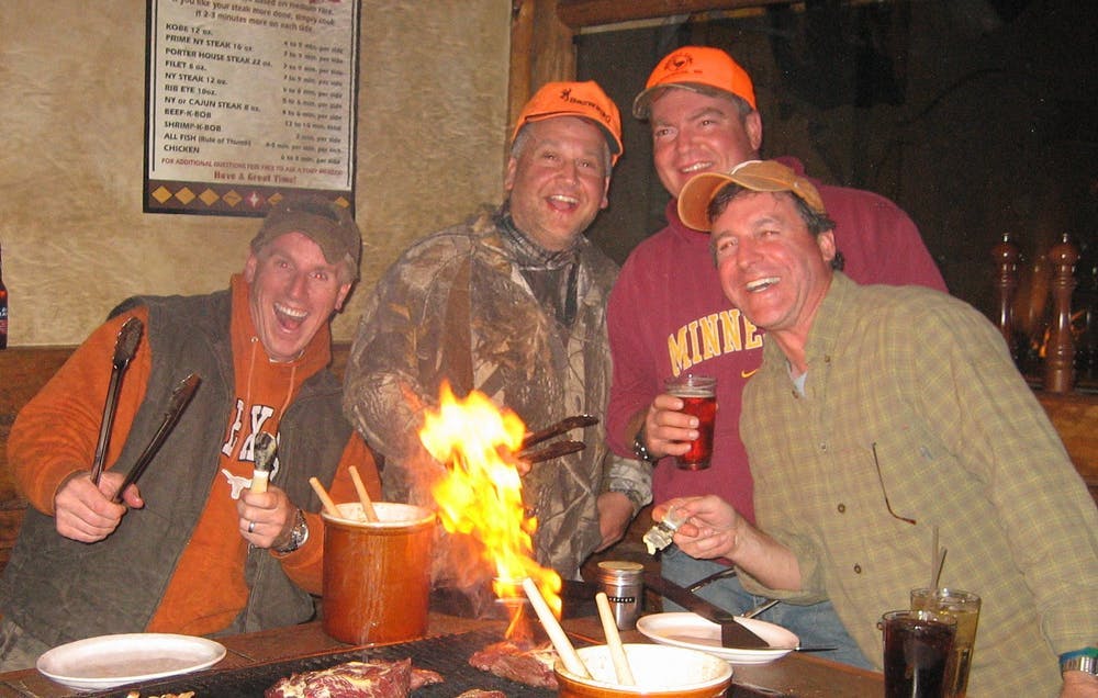 a group of people sitting at a table in a restaurant
