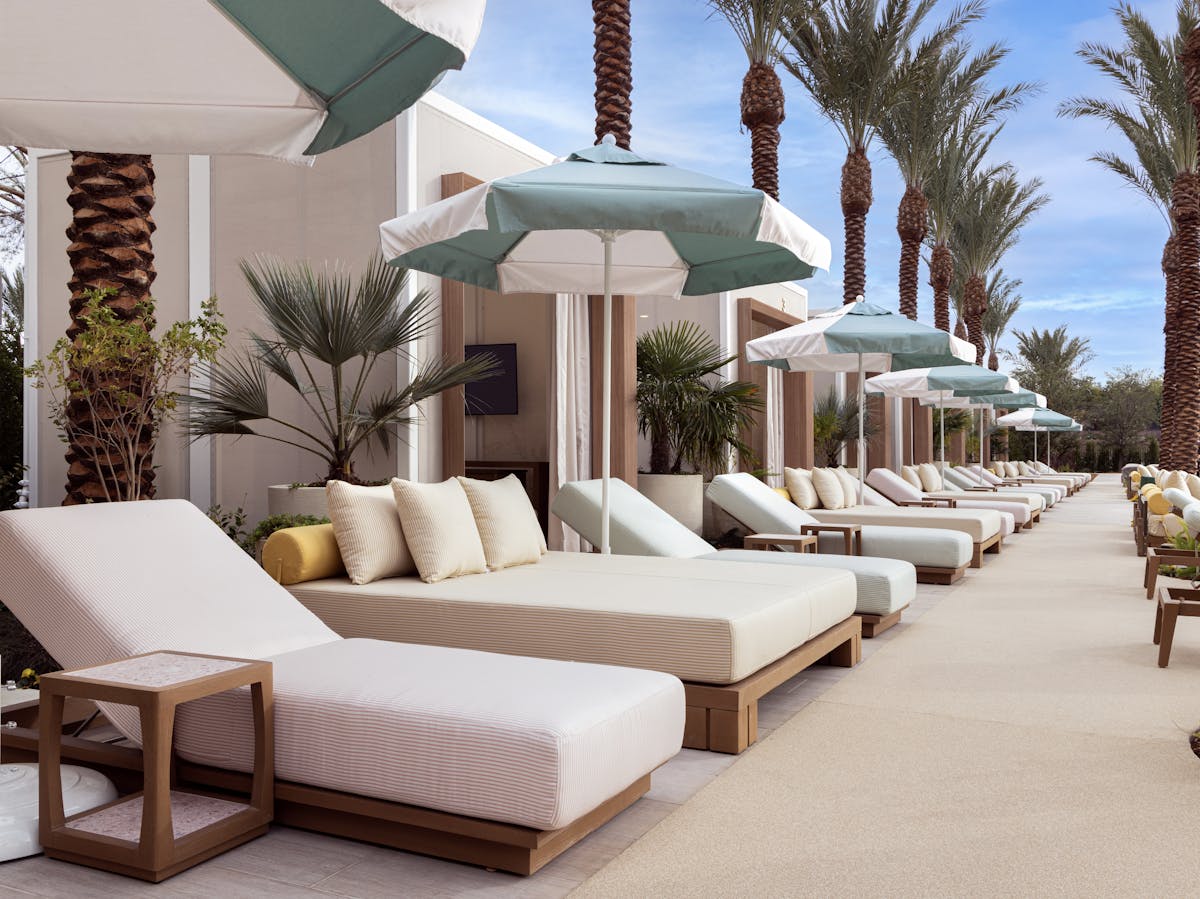Pool side chairs with cabanas.