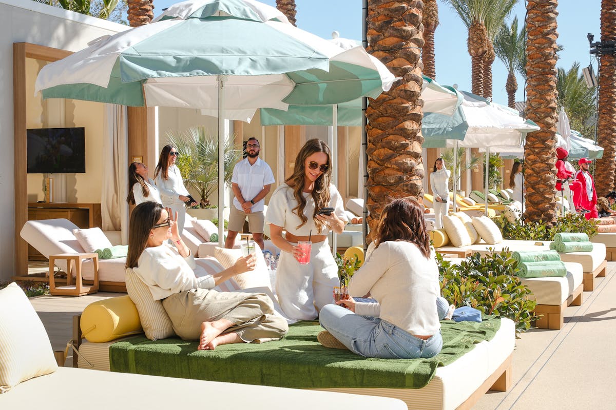 A group of girls on a daybed at the Las Vegas pool bar, Bel-Aire Backyard
