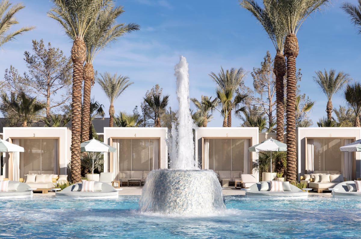 a large pool of water with a fountain, located at durango casino and resort, called Bel-Aire Backyard