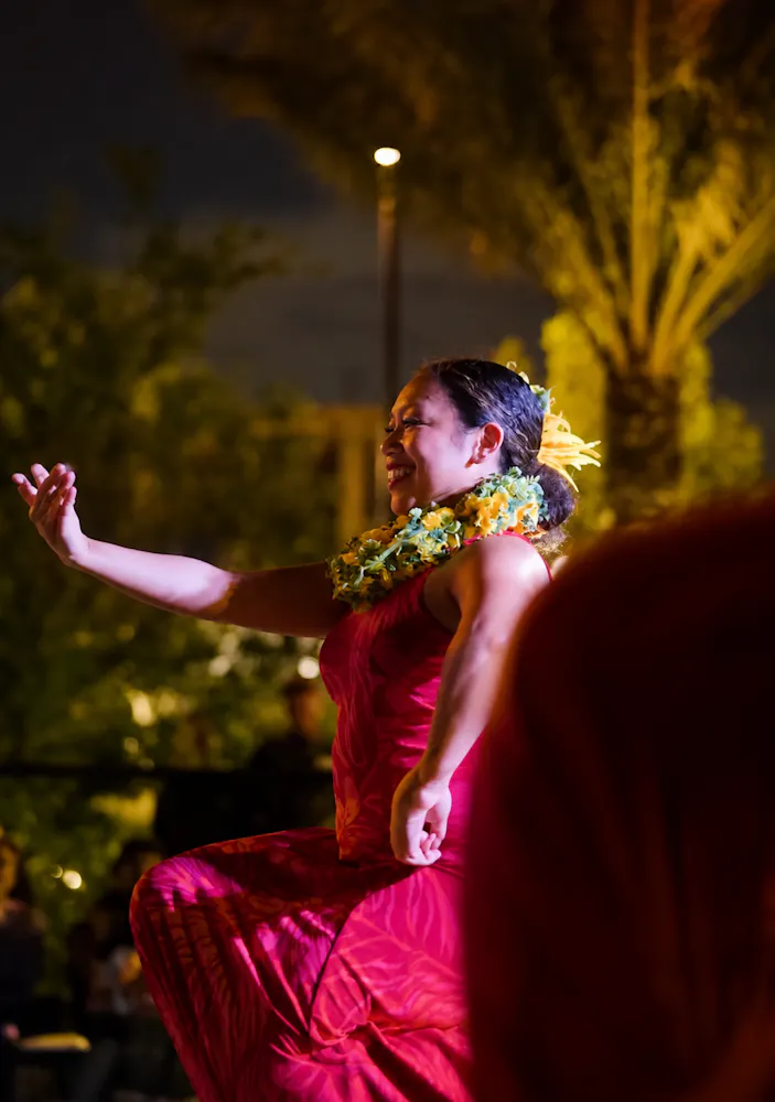 Traditional Tahitian dancer performing during Aloha Fridays at Bel-Aire Backyard resort pool in Las Vegas with tropical island entertainment and live cultural performances.