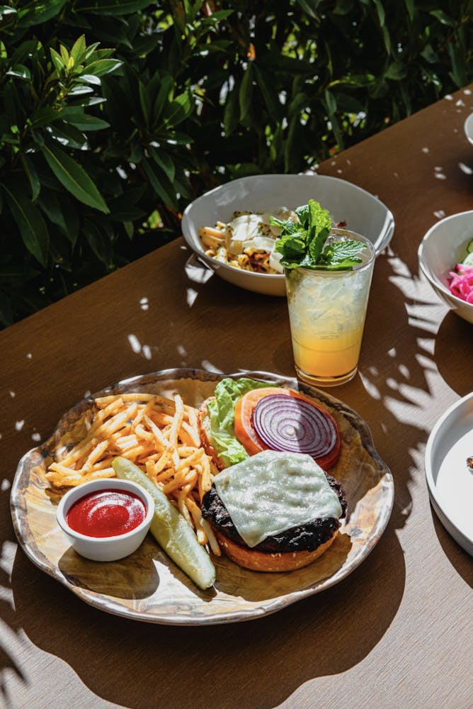 a photo of a hamburger at Bel-Aire Backyard Grill an outdoor dining experience