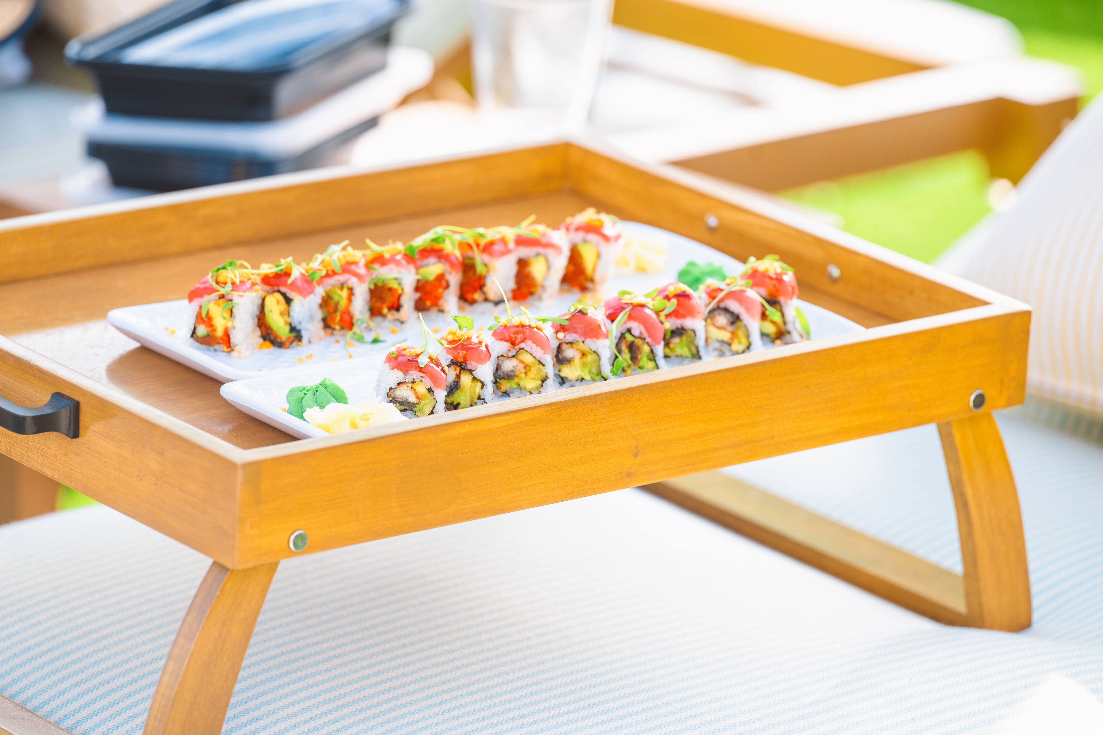 Fresh sushi served poolside at Bel-Aire Backyard, combining outdoor dining Las Vegas with a luxury resort pool and local pool party atmosphere.