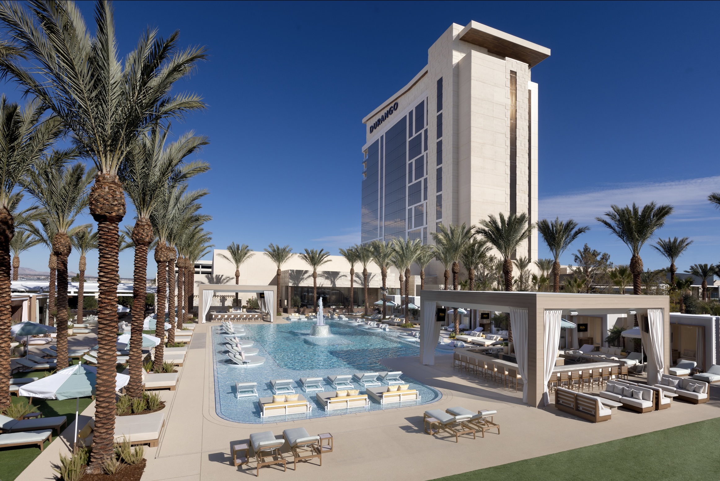 a building that has a sign on the side of a road