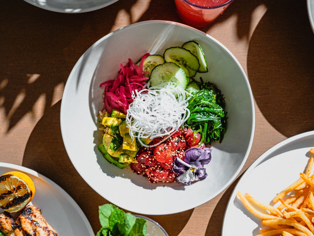 a photo of ahi poke bowl available at the outdoor dining area called Backyard Grill