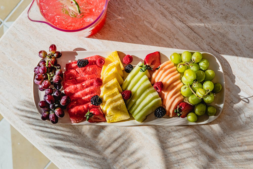 a fruit platter image of what is served in the cabanas at Bel-Aire Backyard