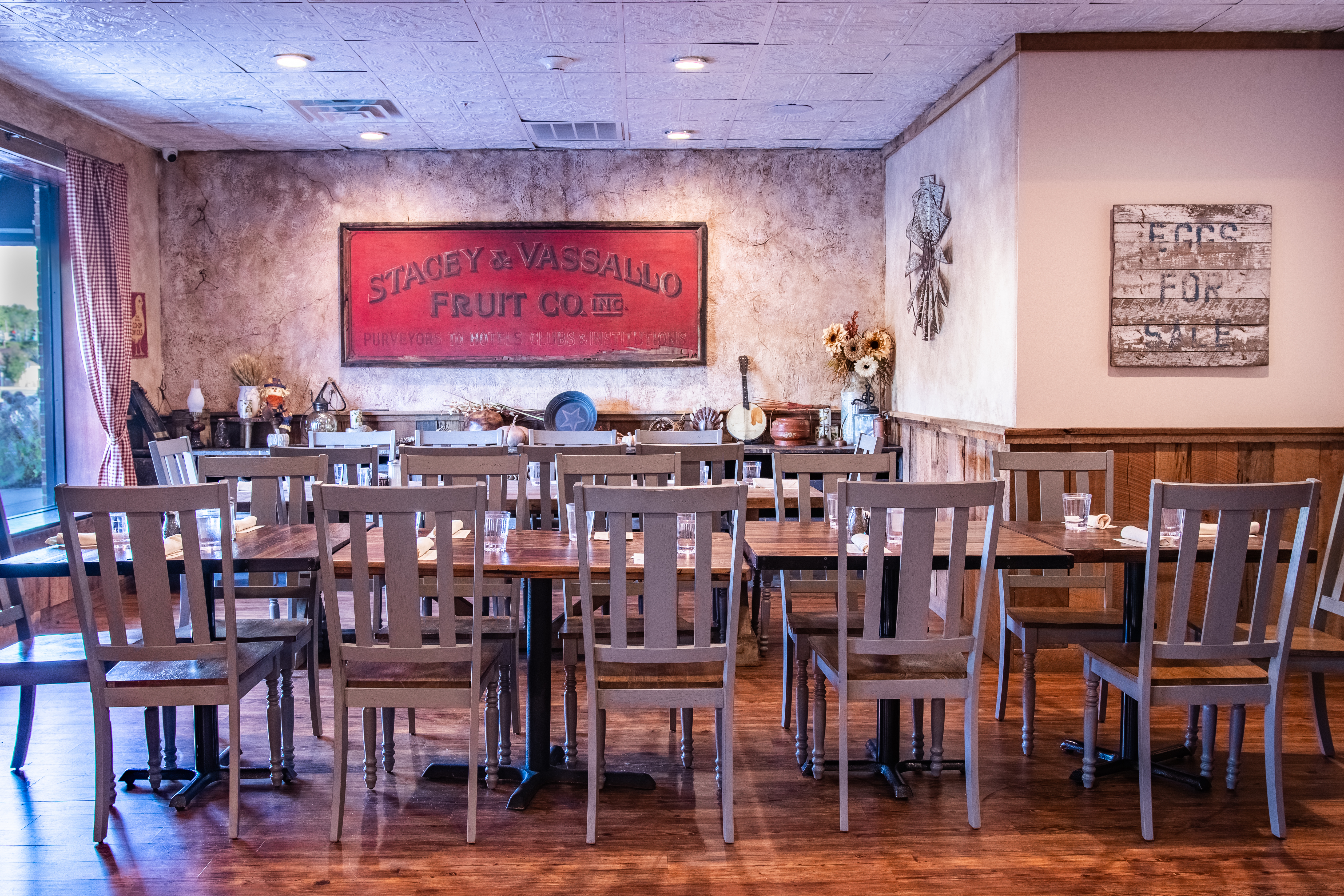 BARN ROOM - smaller dining area for up to 22 people, set for a private event, with a rustic theme