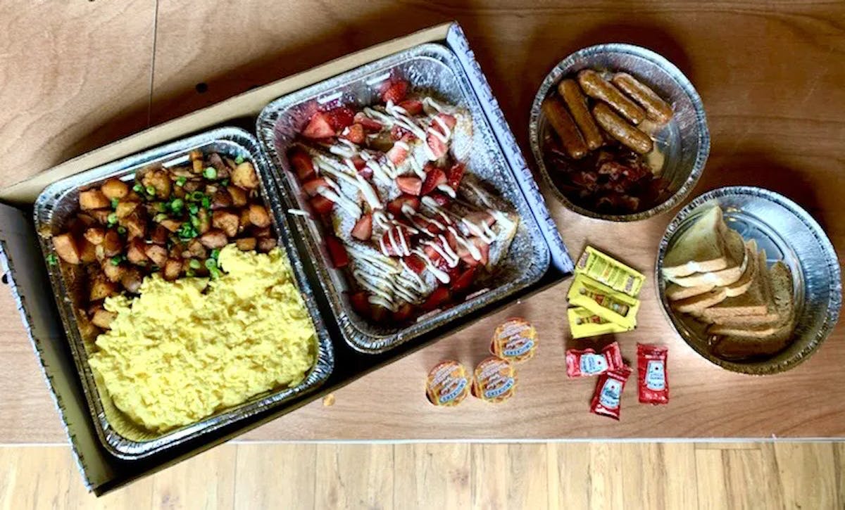 a box filled with different types of food on a table