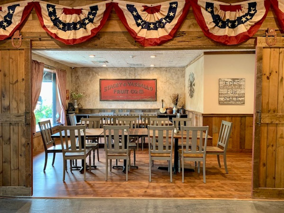 BARN ROOM - set for a private event for 22 guests with rustic decor