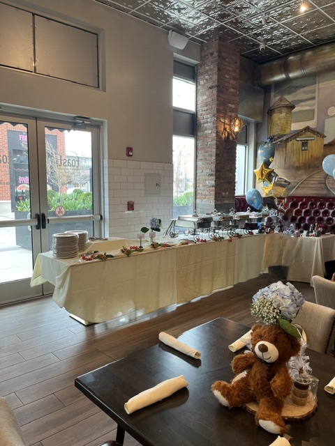 Table with linen and chafing dishes for a buffet set up