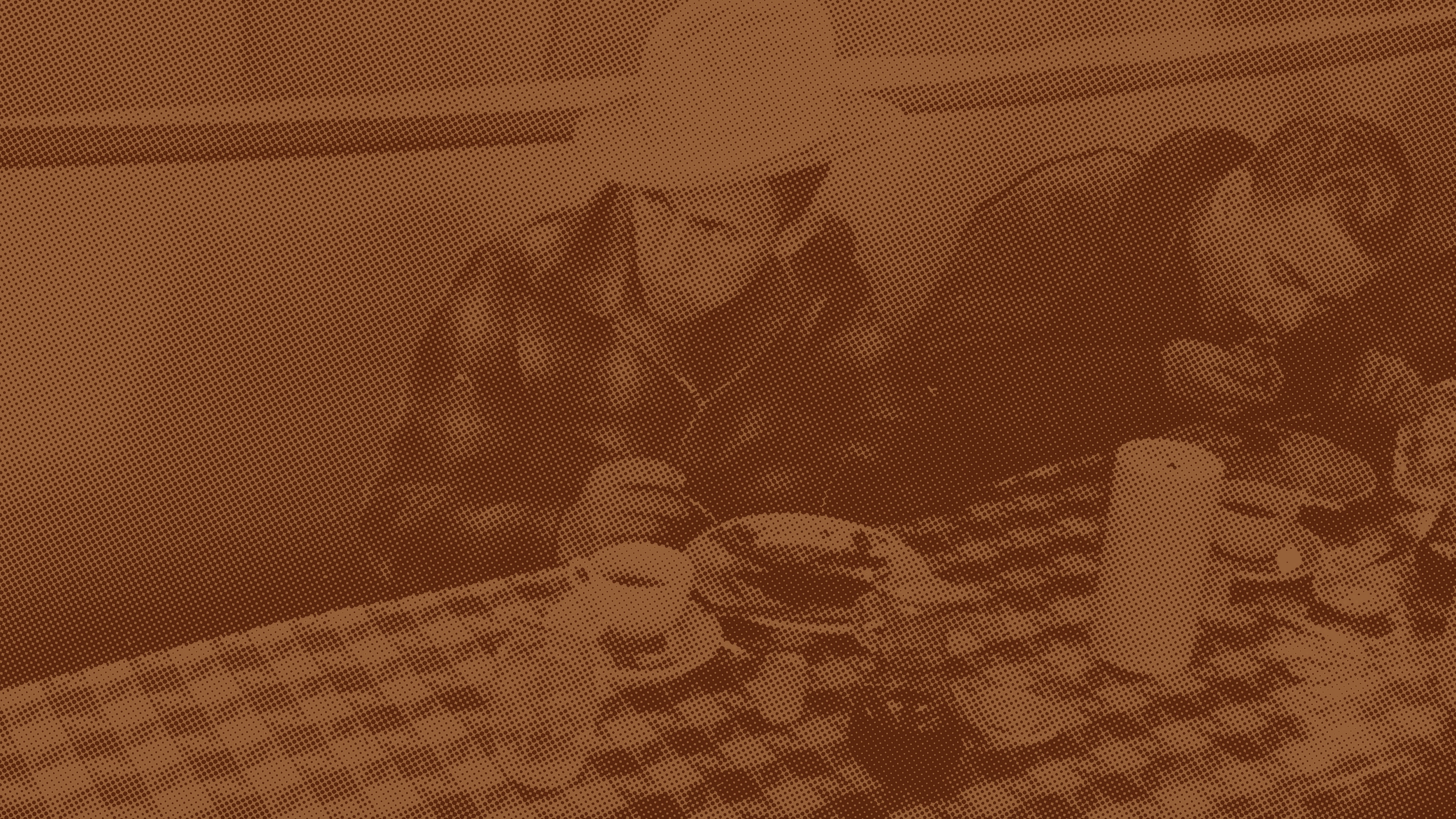 Pixelated photo of a cowboy eating breakfast