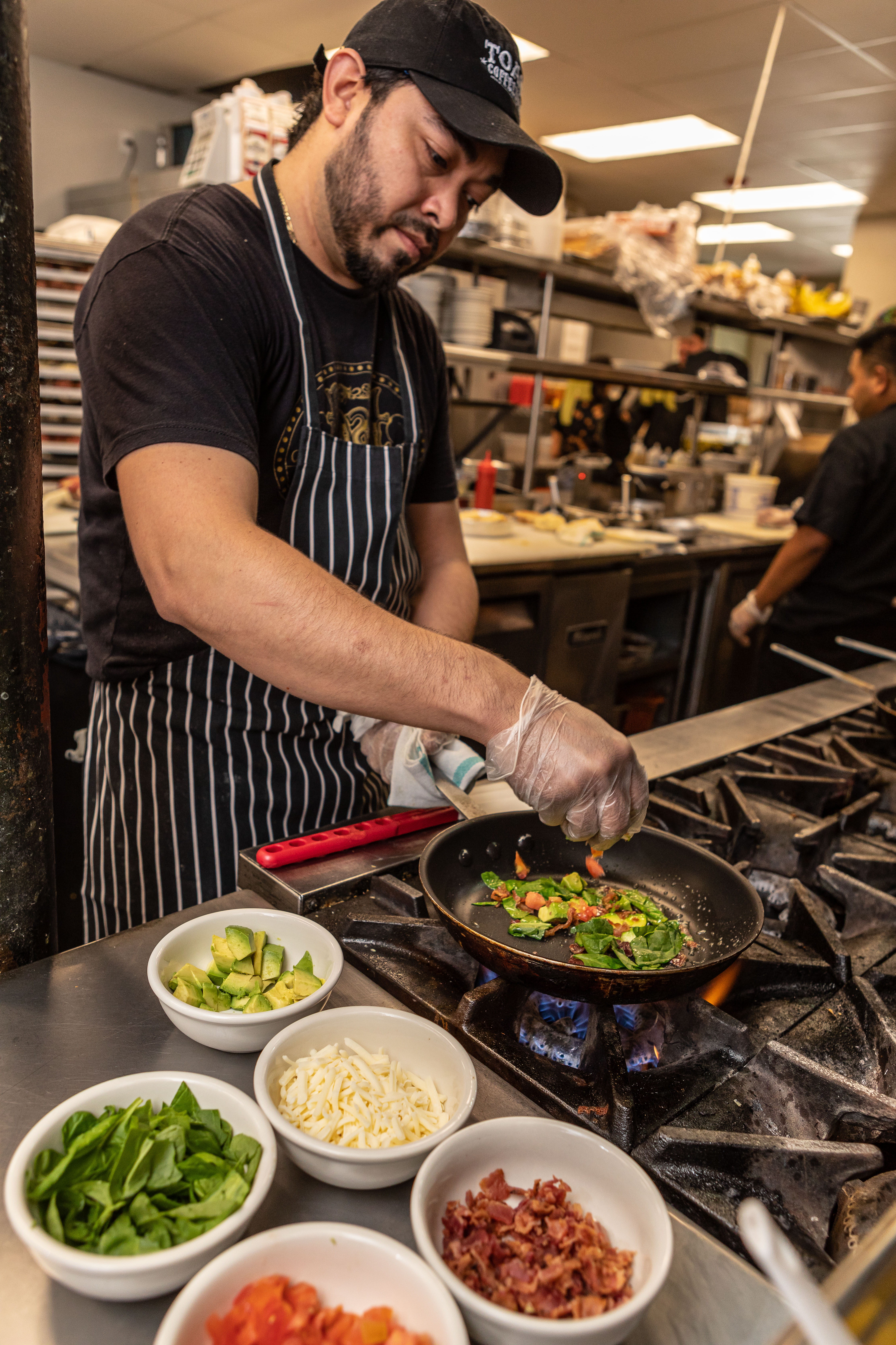 a man sitting at a table with a plate of food
