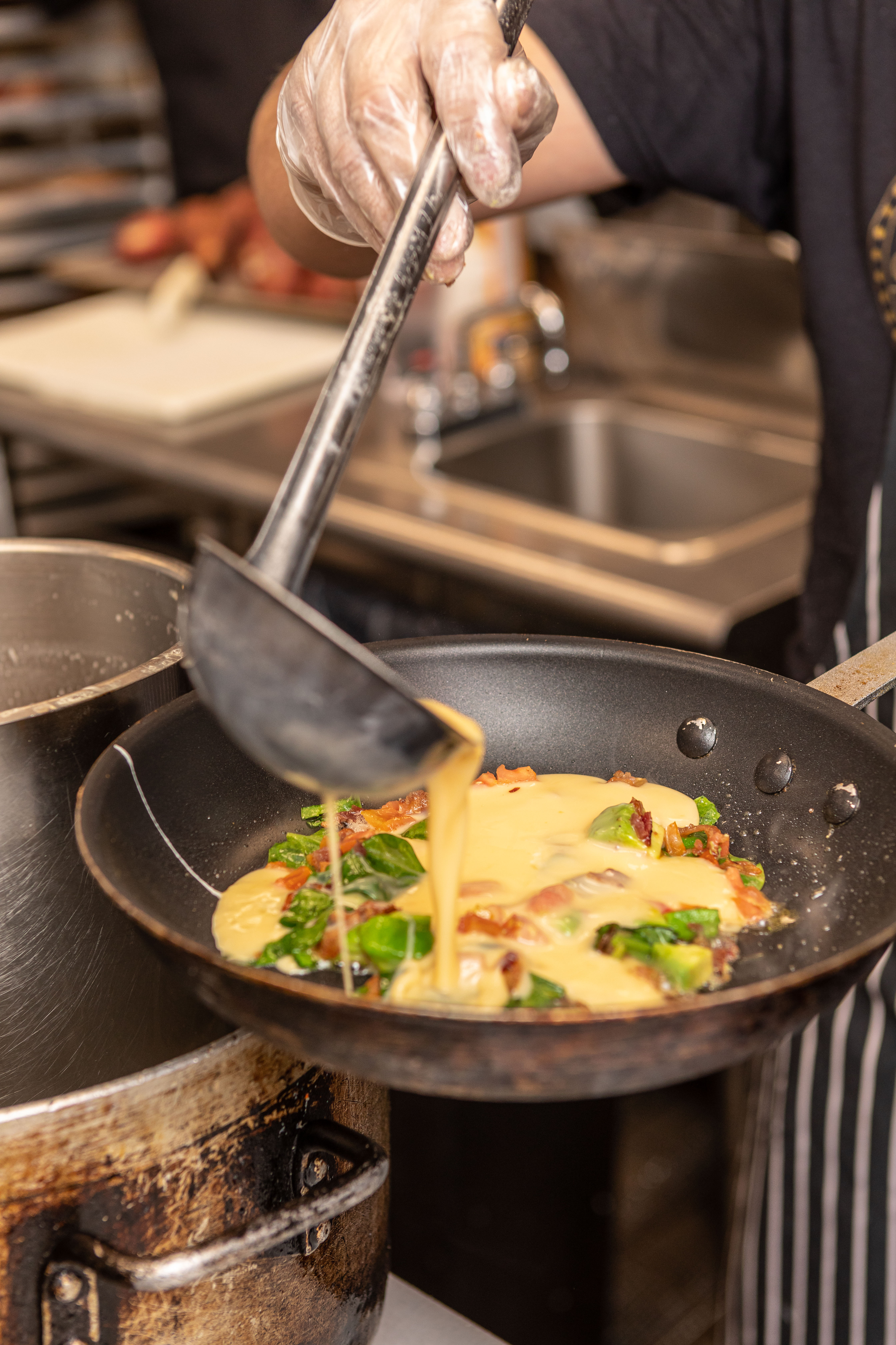 a bowl of food cooking on a stove