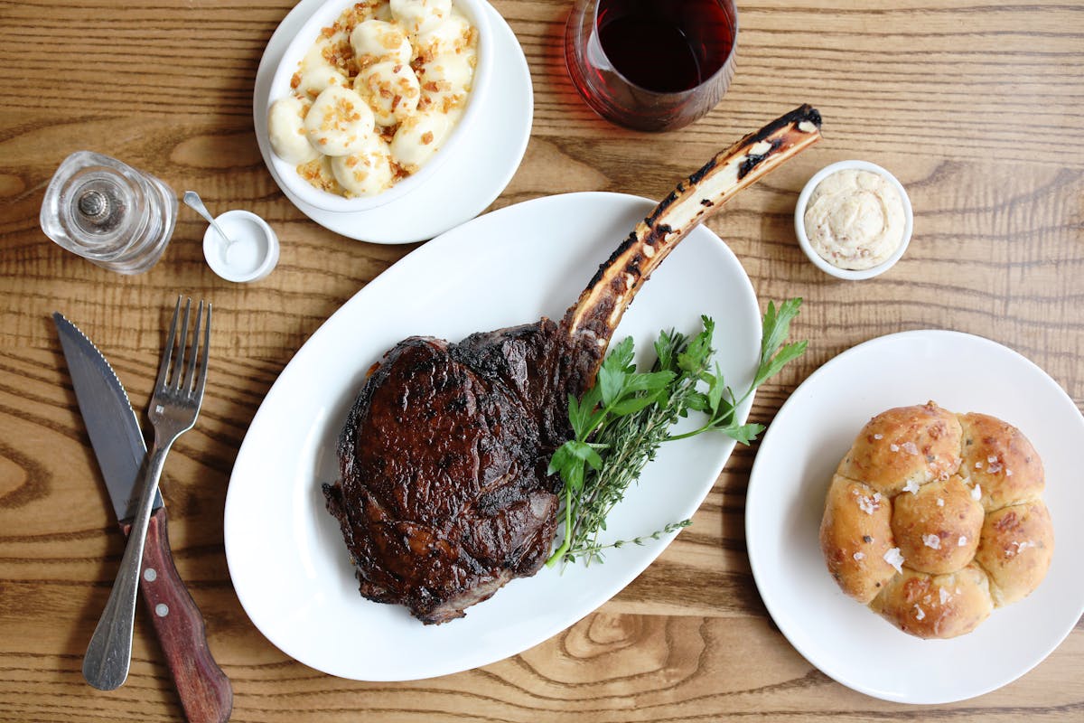 steak on a plate on a wooden table