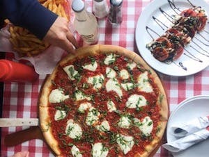 a pizza sitting on top of a table